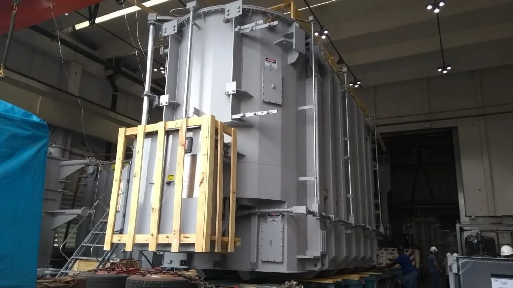 Crated power transformer prepared for heavy lift transport at an industrial facility